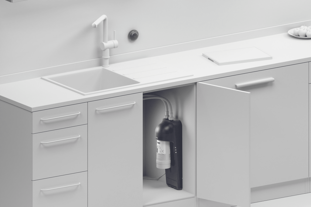 Robi tap water system installed inside kitchen cabinet under the sink.